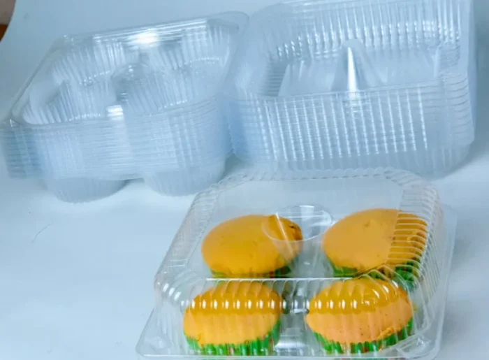 "Open and filled quad muffin packaging from www.jcpackaging.net, with a focus on the ease of access and product visibility."