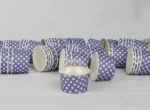 "A collection of medium-sized blue ice cream cups with white polka dots, perfect for serving sweet treats from www.jcpackaging.net."