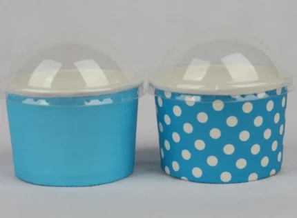 "A collection of medium-sized blue ice cream cups with white polka dots, perfect for serving sweet treats from www.jcpackaging.net."