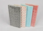 "An assortment of eco-friendly paper straws in various patterns and colors, available at www.jcpackaging.net."