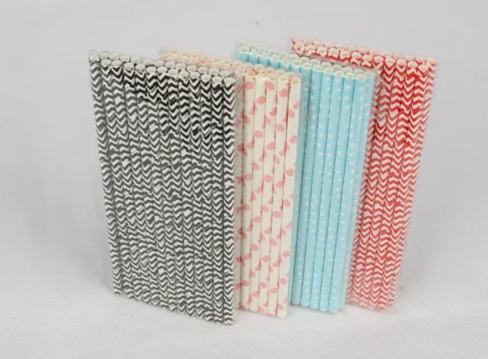 "An assortment of eco-friendly paper straws in various patterns and colors, available at www.jcpackaging.net."